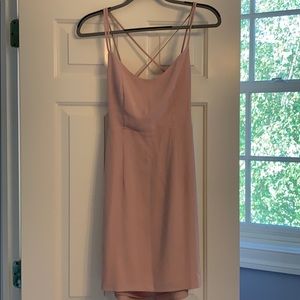 Light pink mini dress with strappy back.